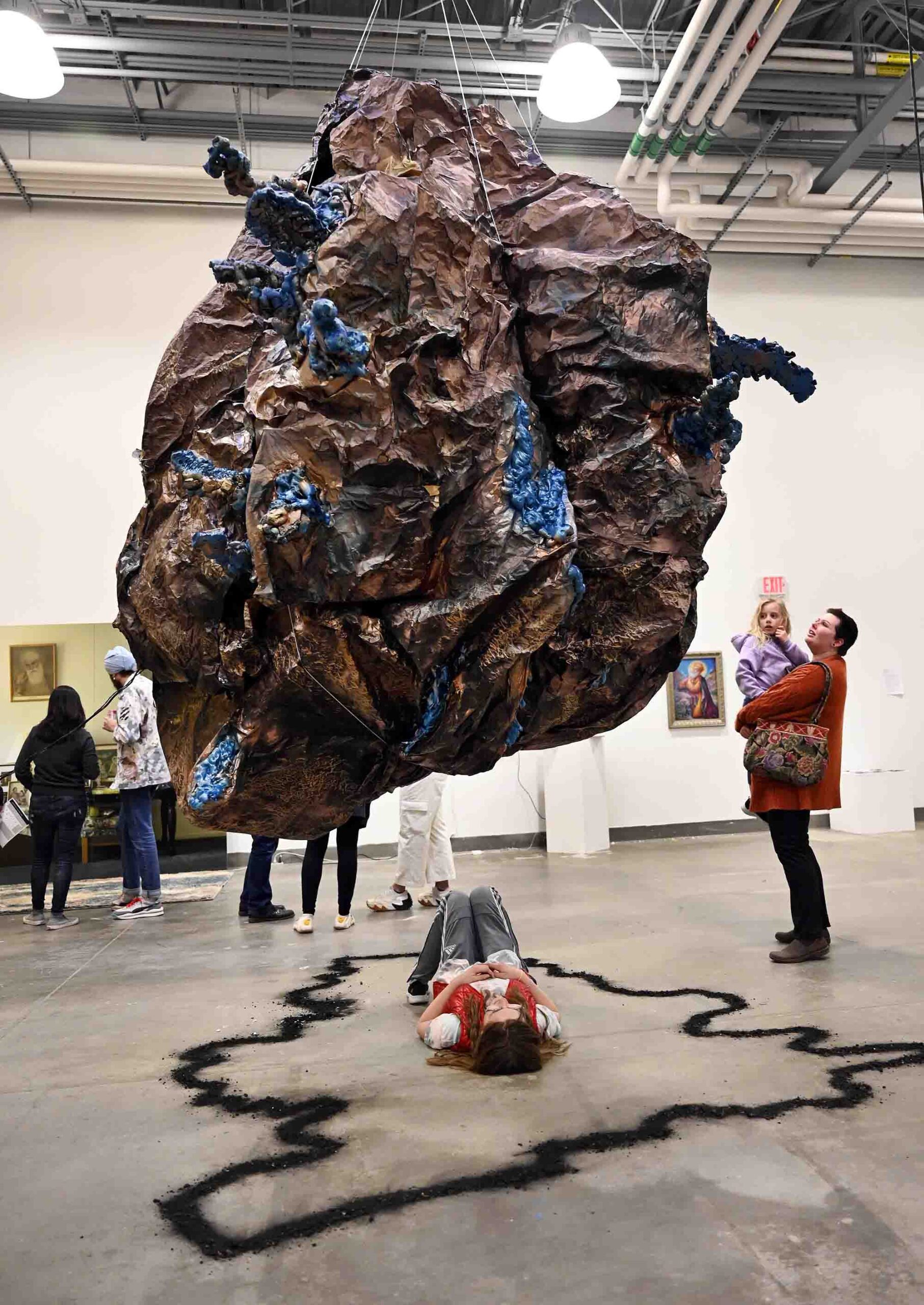 TRAVERSE-1.1 breathing boulder sculpture with spectators