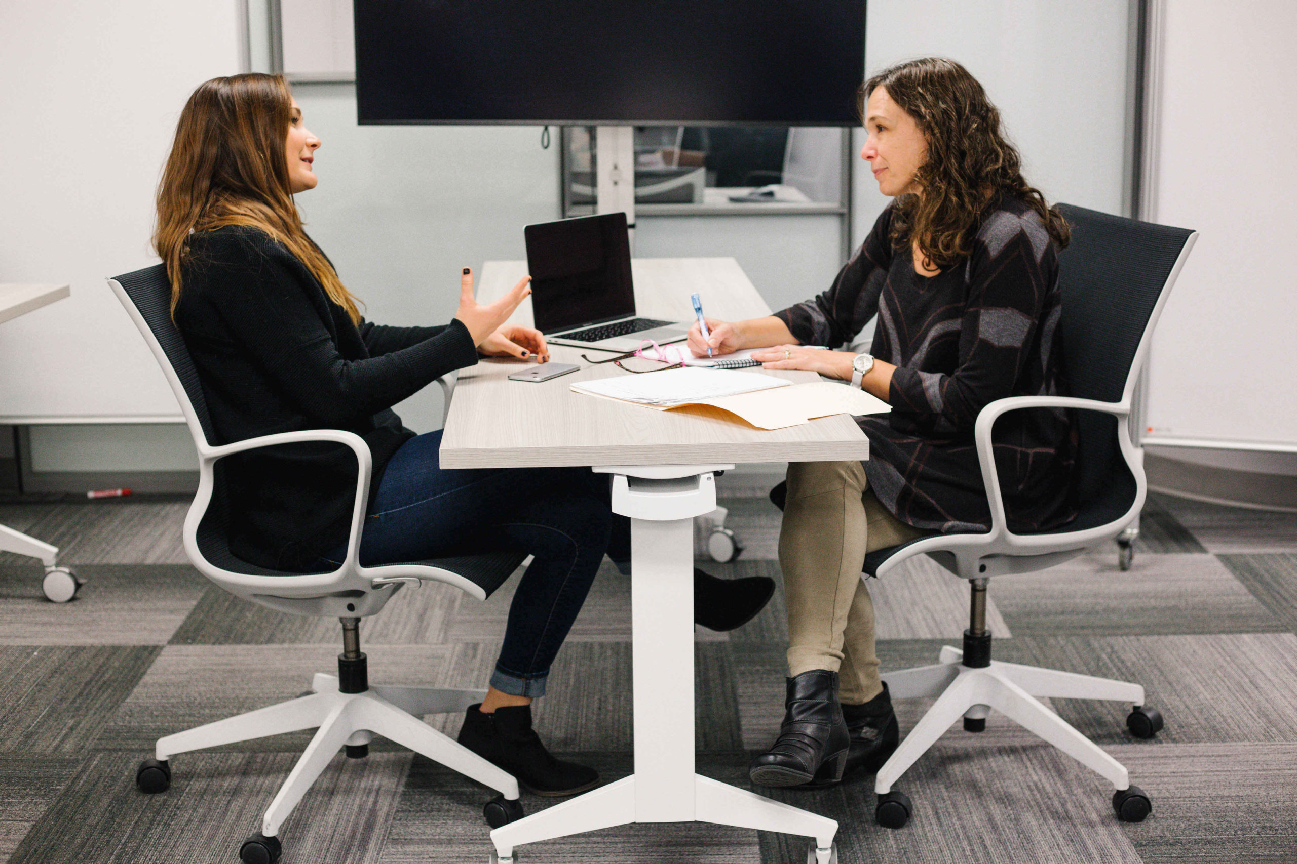 rsz_faculty_msf Two women sitting across from each other at a desk