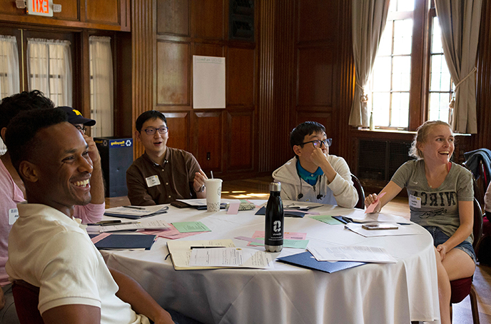 IA-Orientation IA orientation, with 4 people shown sitting at a round table