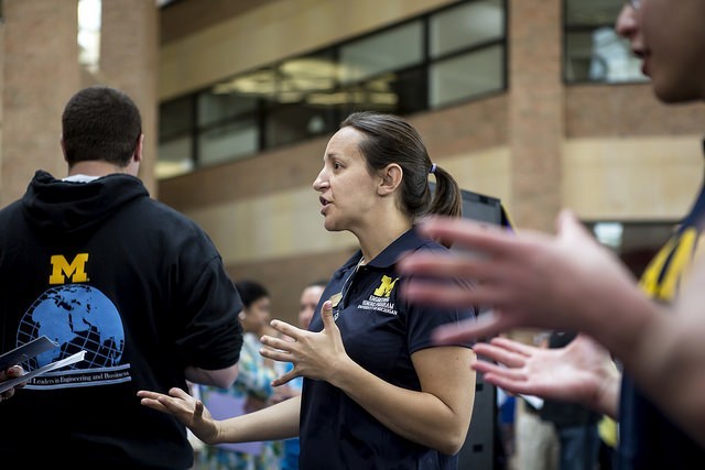contact_us staff at booths telling prospective students about honors program