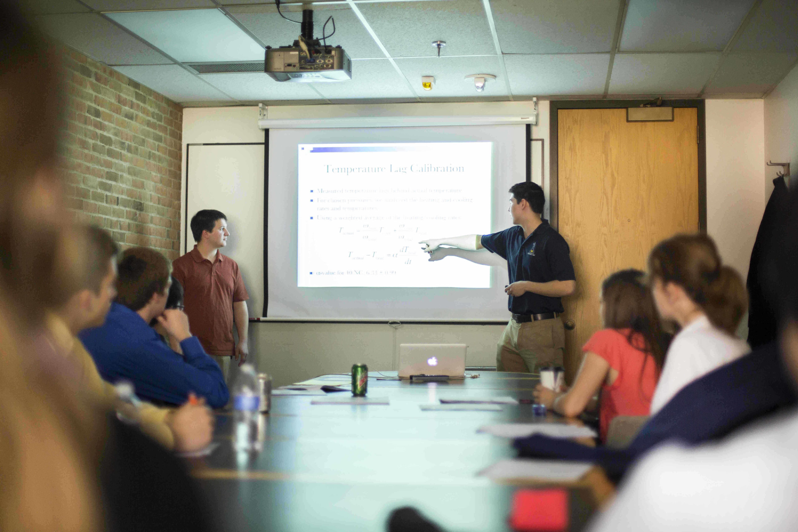 Staff members listening to a presentation