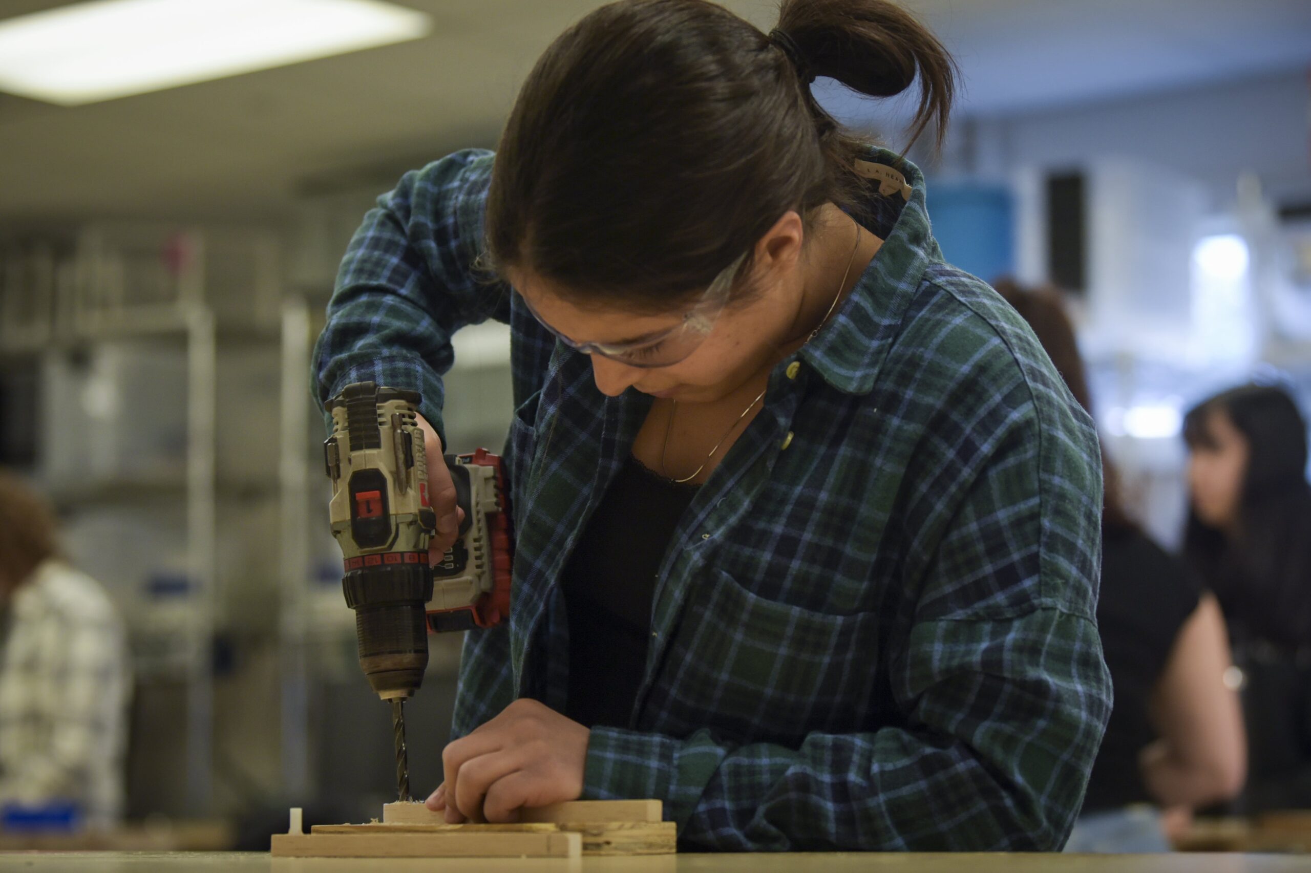 student using a drill