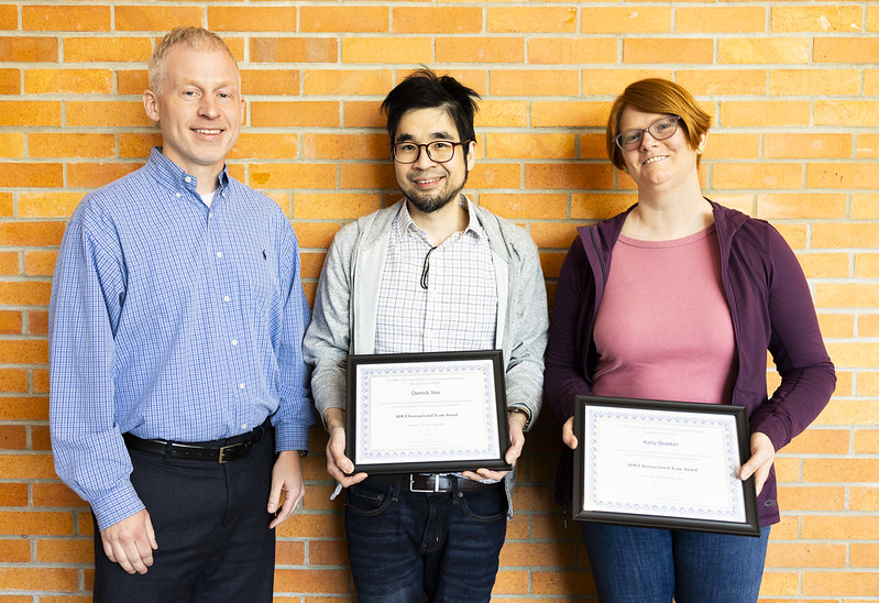 2024 ADUE Team Teaching award (1) Kevin Pipe presenting "Teaching Award" to Lisa Grimble next to a headshot of Laura Hirshfield